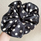 Black cotton polka-dot scrunchie with white dots, gathered circular bow