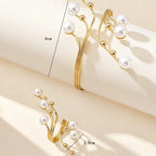 Gold-tone pearl bracelet set with white bead drops; size marks 6cm and 1.8cm