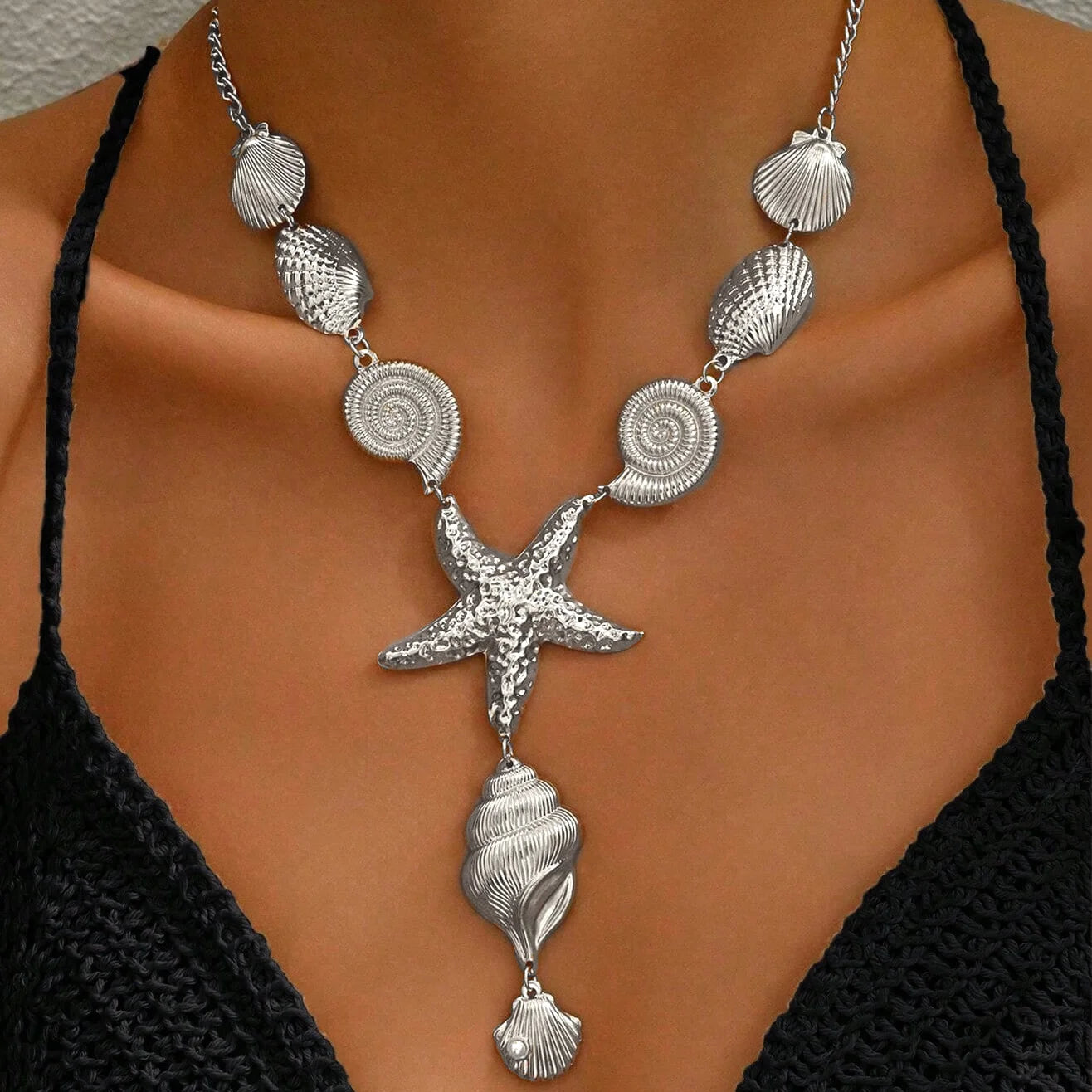 Silver shell and starfish necklace with spiral shell medallions and scallop shell drops