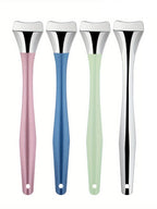 Facial blackhead removal tool set of four: pink, blue, green, and silver handles
