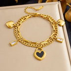 Gold layered chain bracelet with heart pendant and dangling square zircon details