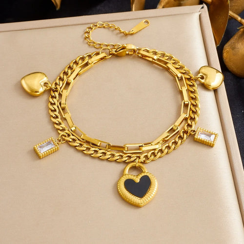 Gold layered chain bracelet with heart pendant and dangling square zircon details