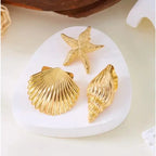 Gold starfish and shell hair clips: starfish plus two scallop-shell clips