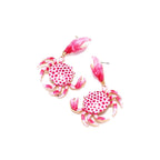 Crab enamel drop earrings with red-and-white dotted bodies, pink claws, and gold hooks