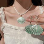 Starfish shell dangle earrings with gold starfish and mint-green scallop shell drops