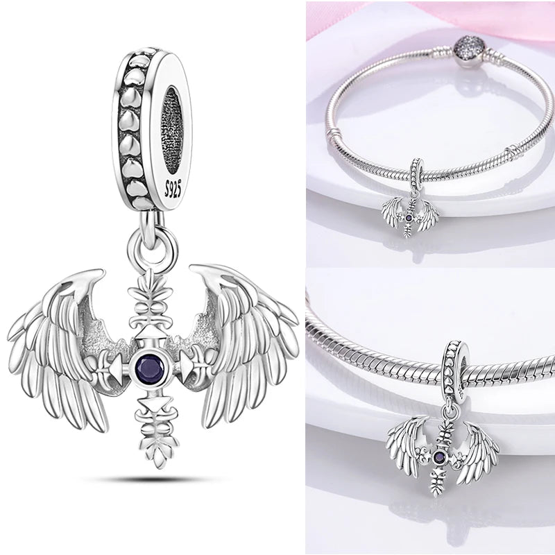 Sterling silver angel wings charm with purple crystal center