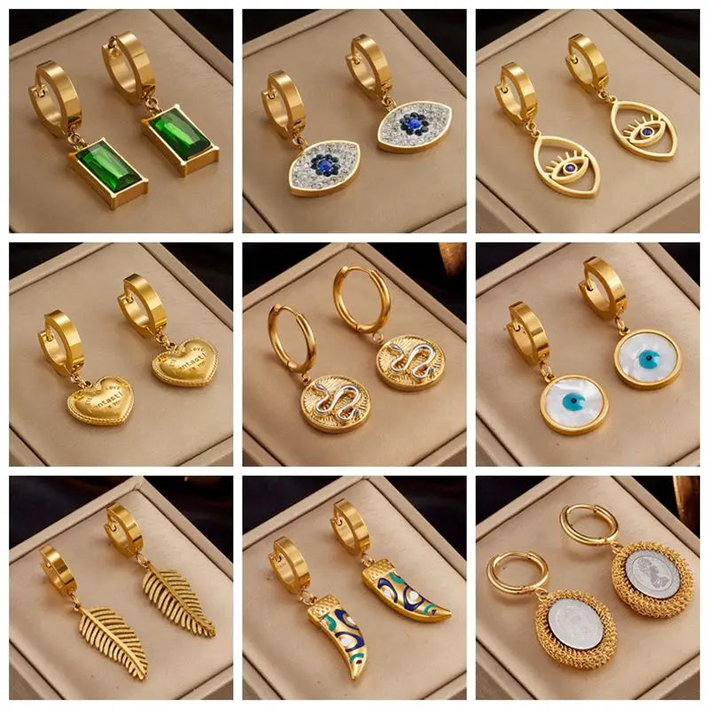 Gold hoop earring set with assorted enamel charms including heart and eye styles