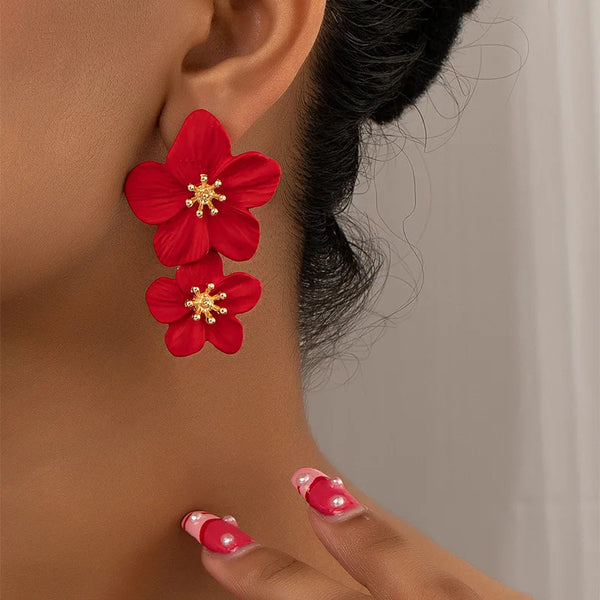 Red double-layer flower dangle earrings with gold-tone centers, two stacked petals per earring