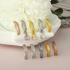Titanium belly button clicker hoops with crystal stones in gold, silver, and rose-gold tones