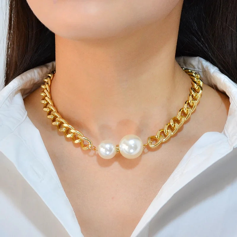 Gold-tone Cuban chain pearl necklace with two white round pearls at the center
