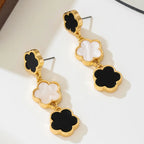 Five-petal flower long drop earrings, gold-tone with white enamel clover and black enamel drops