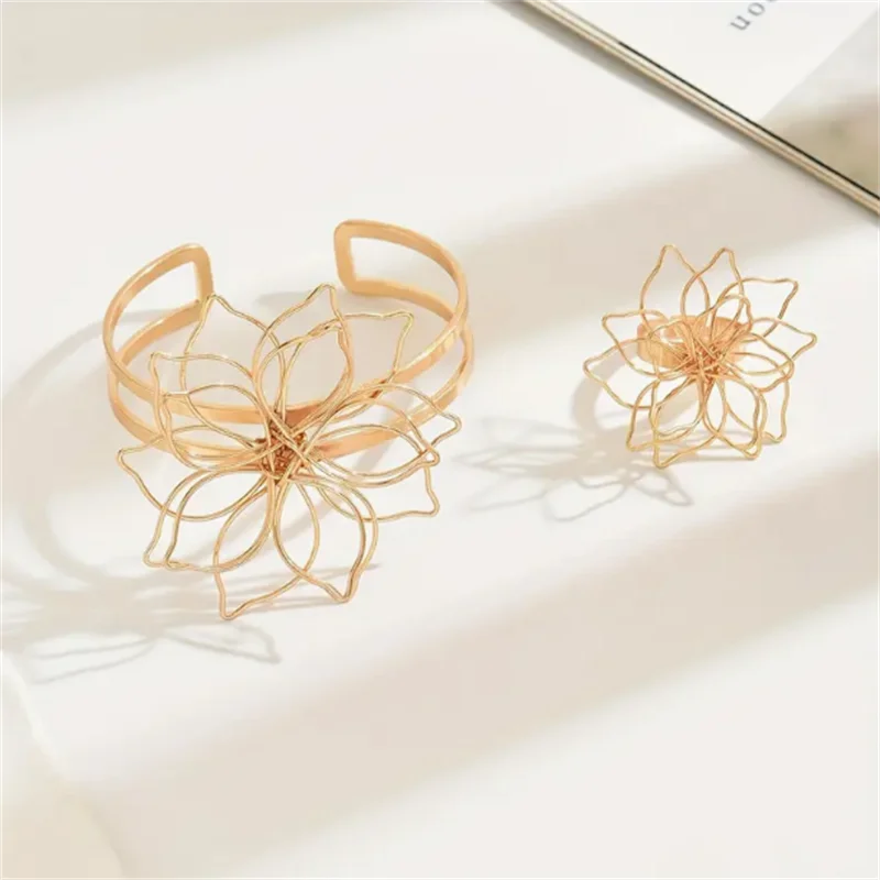 Gold hollow flower bracelet cuff and ring set, two-piece openwork blossom design
