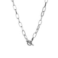 Silver-tone oval link chain collar necklace close-up with heart clasp and bar charm