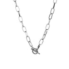 Silver-tone oval link chain collar necklace close-up with heart clasp and bar charm