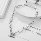 Silver-tone oval link chain collar necklace with heart clasp and bar charm