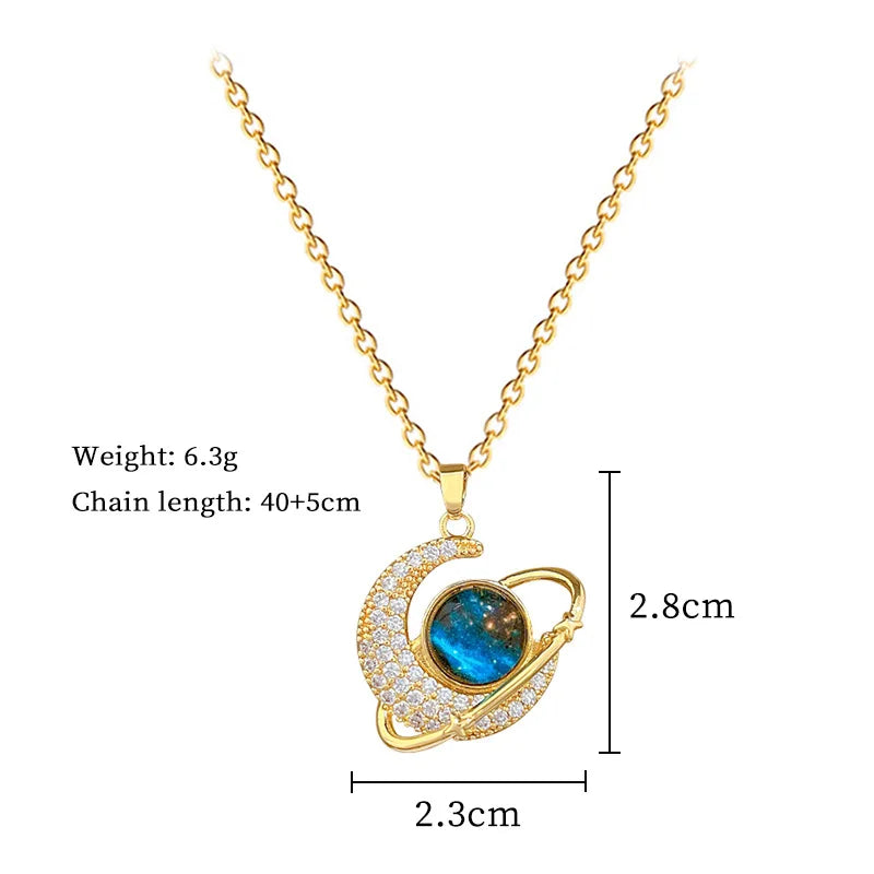 Crescent moon pendant necklace with blue oval gemstone; gold chain, rhinestone halo