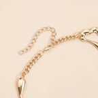 Gold-tone necklace chain with clasp and lava drip detail