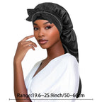 Black satin sleep bonnet with knotted bow and gathered crown, covering hairline