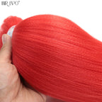 Red synthetic braiding hair extension bundle, held by hand, thick strands