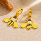 Gold-tone hoop earrings with dangling bee charms and round pearl accents
