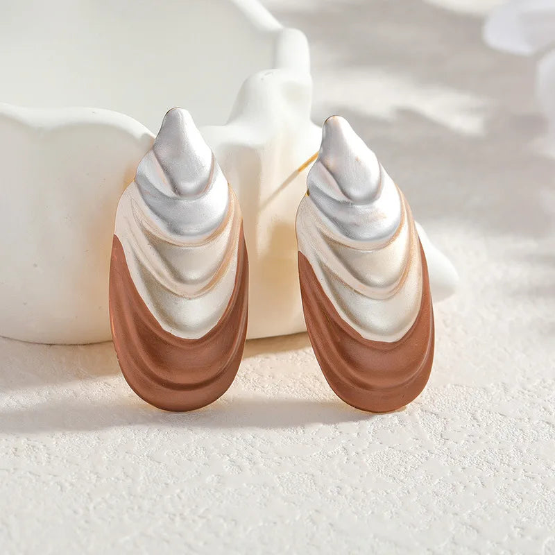 Flower-shaped stud earrings, two-tone silver and rose, curved petal design