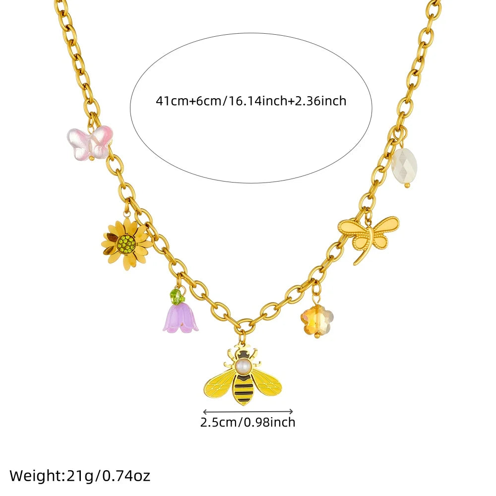 Gold-tone bee and flower charm necklace with pearl and colorful dangle accents