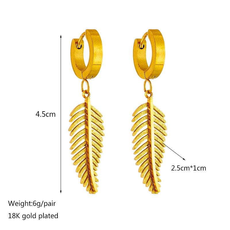 Gold hoop earrings with gold feather dangle charm