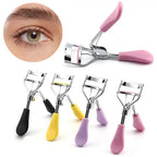 Eyelash curler tool set with pink, black, yellow, and purple handles and eye guide