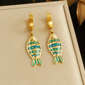 Fish enamel huggie hoop earrings, gold-tone with teal and blue striped fish charms