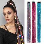 Multicolor hair tinsel strands with starlike glitter on a clip, worn on dark hair