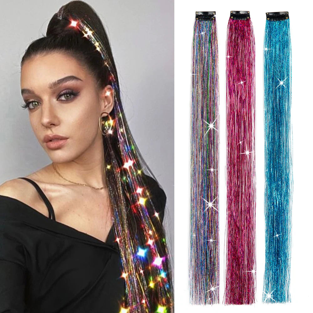 Multicolor hair tinsel strands with starlike glitter on a clip, worn on dark hair