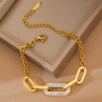 Gold geometric chain bracelet with open bar links and sparkling pave centerpiece