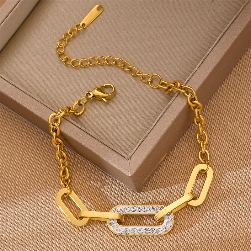 Gold geometric chain bracelet with open bar links and sparkling pave centerpiece