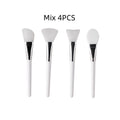 Set of 4 face mask brushes with white silicone heads and chrome collars