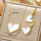 Gold-plated necklace and earrings set featuring white heart shell charms