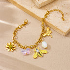 Gold-tone bee and flower charm bracelet with pearl and pastel dangle charms