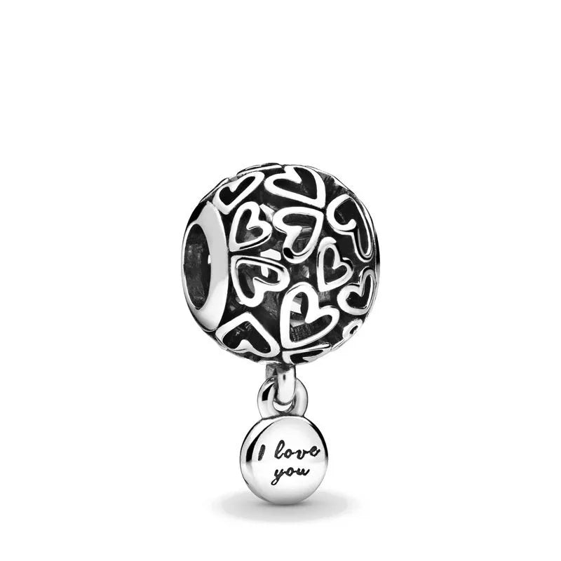 Sterling silver patterned charm bead with a dangling “I love you” disc