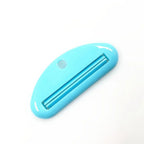 Turquoise toothpaste tube squeezer dispenser with metal channel and round hanging hole