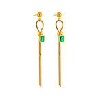 Gold-tone long drop earrings with round bead tops, green square charm, and fringe tassels