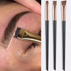 Eyeliner and eyebrow makeup brushes, three flat angled tips on beige handles