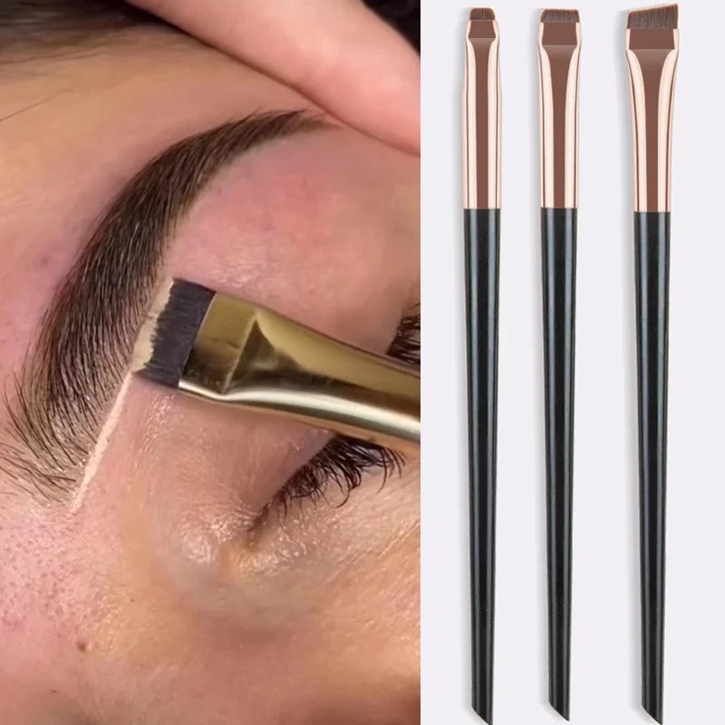 Eyeliner and eyebrow makeup brushes, three flat angled tips on beige handles