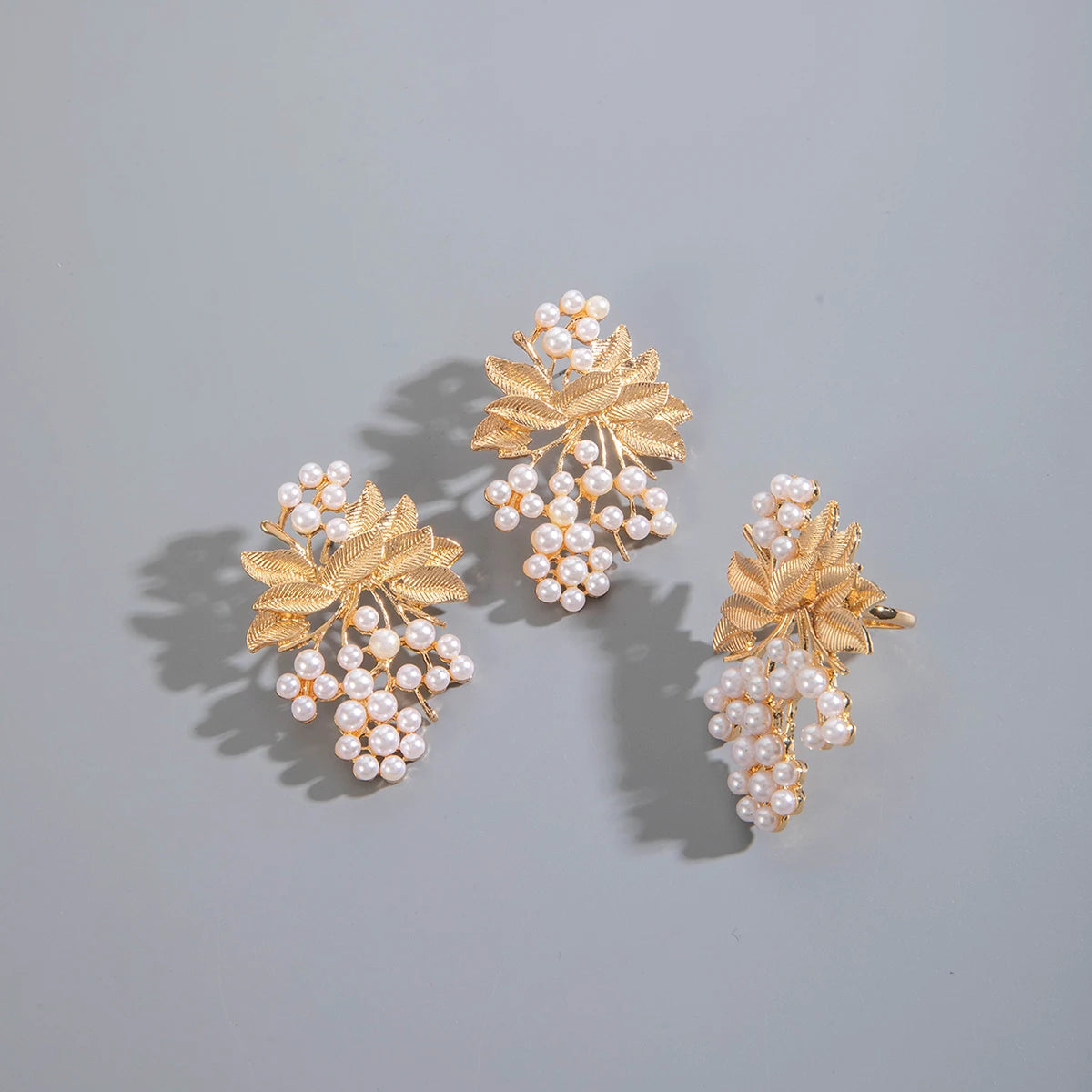 Pearl and gold-tone leaf cluster drop earrings, three styles