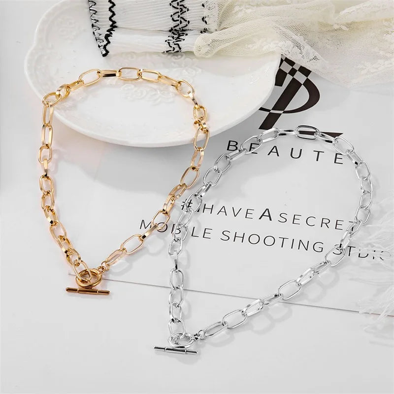 Gold- and silver-tone oval link collar necklaces with oval clasp and bar charm