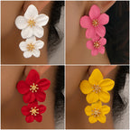 White double-layer flower dangle earrings with gold-tone star centers