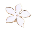 White flower adjustable ring with five white petal shapes and gold-tone band