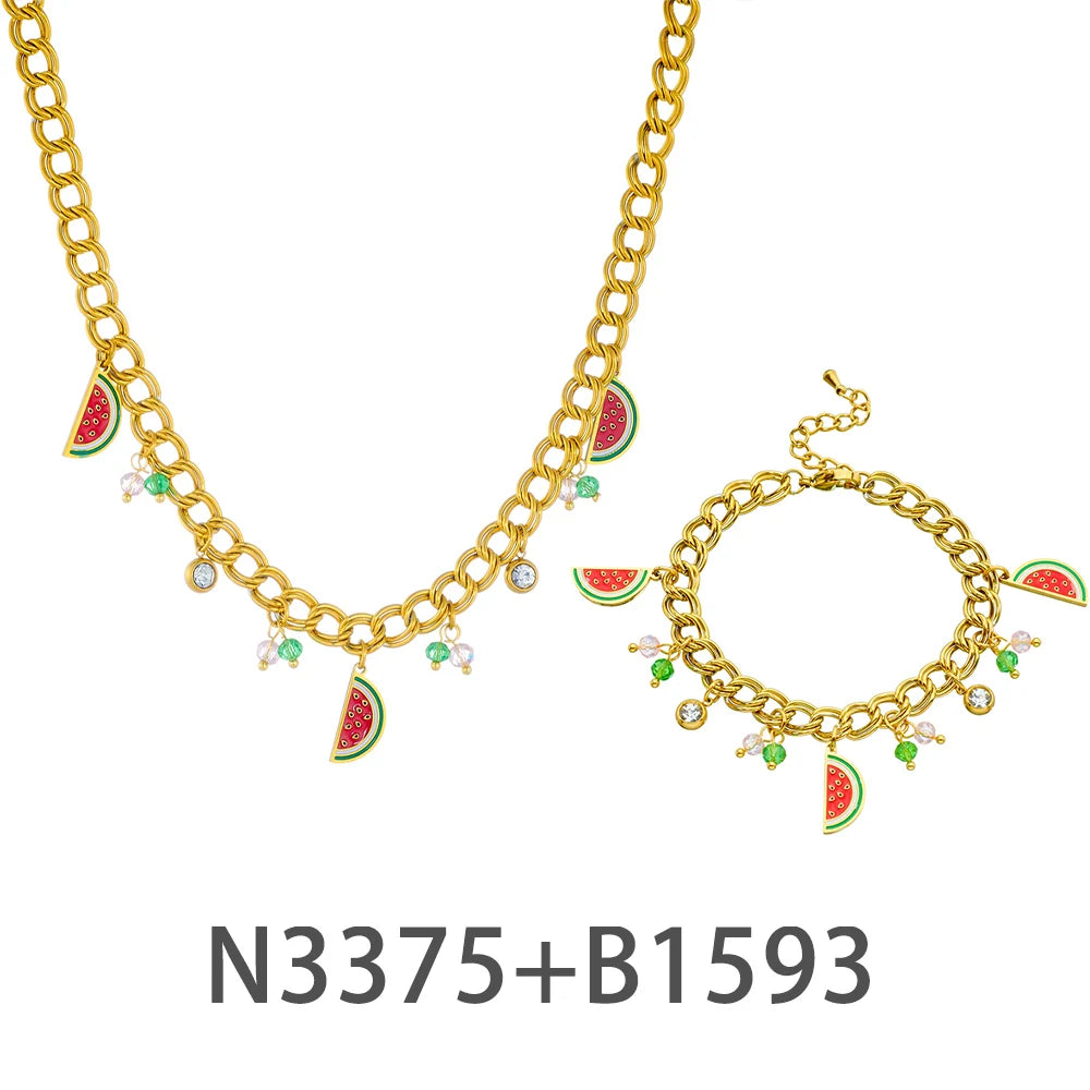 Gold-tone watermelon enamel pendant necklace with small clear stones and charm slices