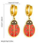 Gold-tone ladybug drop hoop earrings with red enamel body and black accents; size-mark diagram