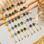 Gold flower bracelet with multicolor enamel clover charms and chain links