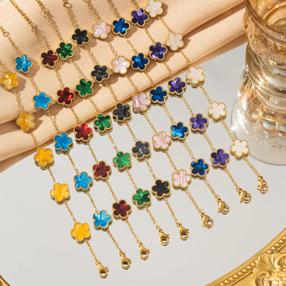 Gold flower bracelet with multicolor enamel clover charms and chain links