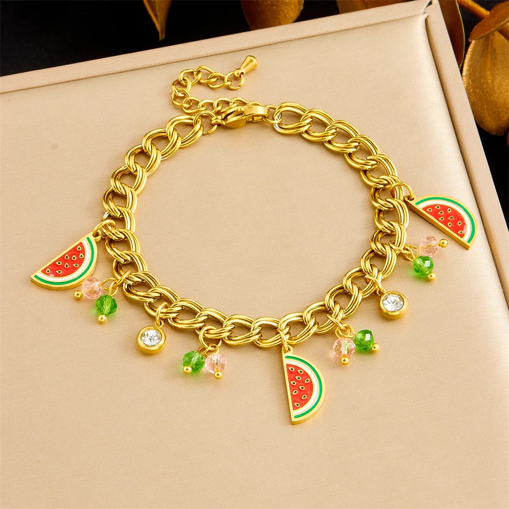 Watermelon enamel charm necklace on box, gold-tone chain with red-green watermelon pendants